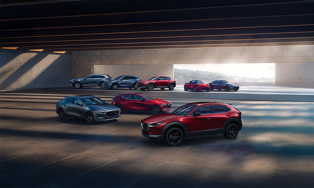 Showroom with one of each Mazda model in Soul Red Crystal or Eternal Blue Mica