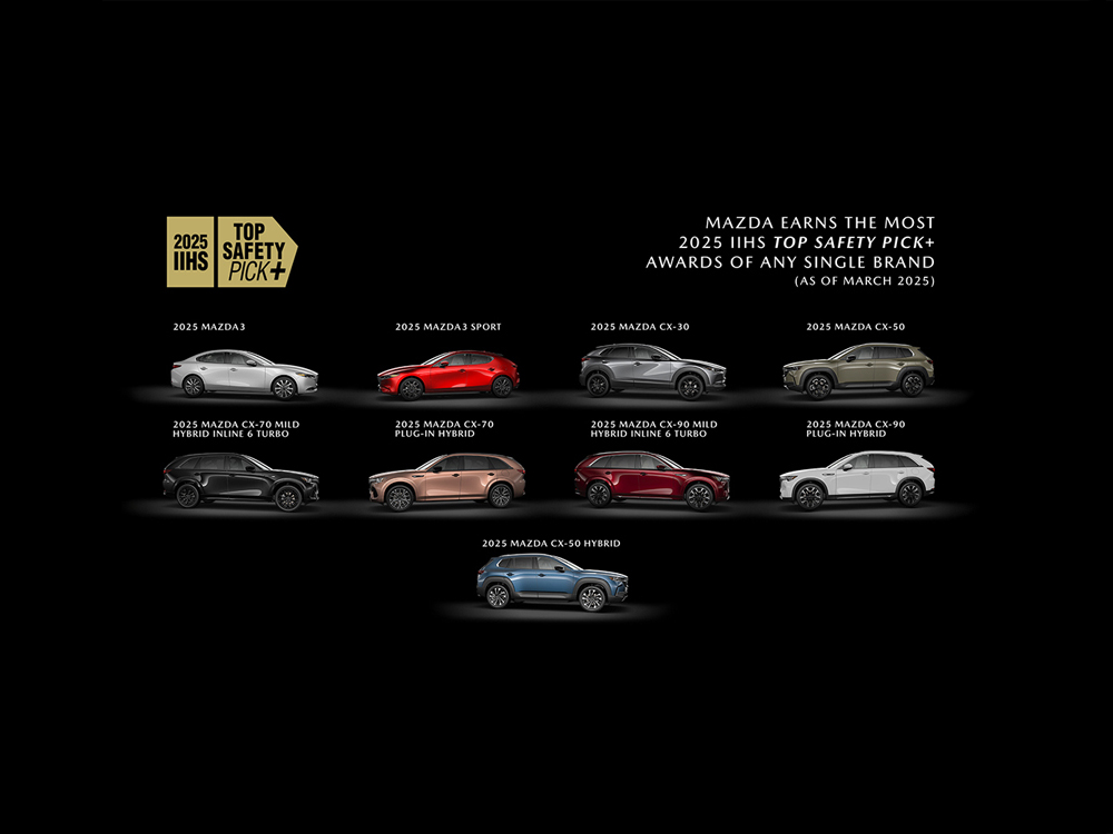 Showroom floor featuring all Mazda car models in either red or grey. 