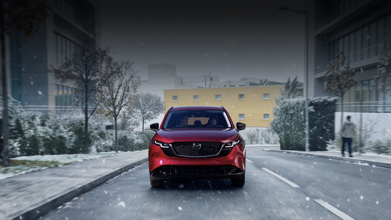 A Mazda CX-5 driving on a snowy road