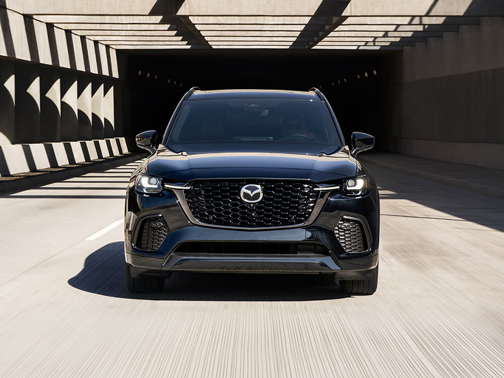 Front of CX-70 Inline 6 Turbo as it exits tunnel in day light.