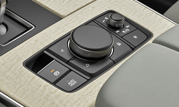 Close up of centre console material texture, dials and buttons.