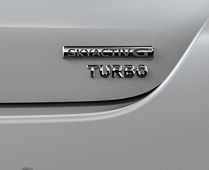 Close-up of Skyactiv-G TURBO badge. 