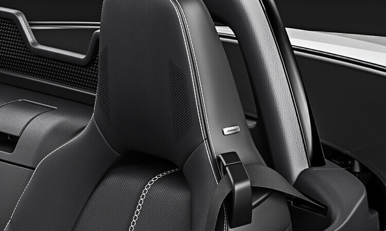 Image of MX-5 RF car seat headrest with integrated audio system. 