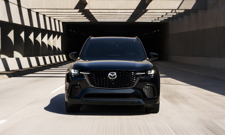 Front view of the CX-70 driving out of a tunnel.